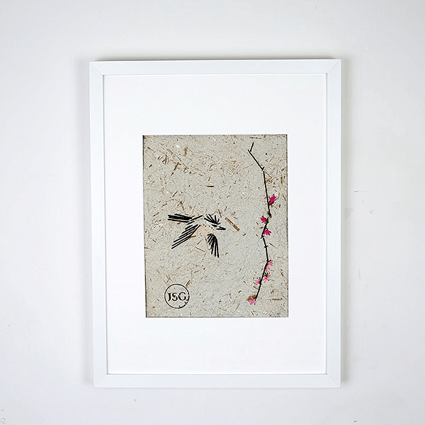 embroidery of a bird on handmade paper