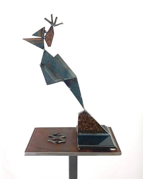 metal sculpture of a woodpecker