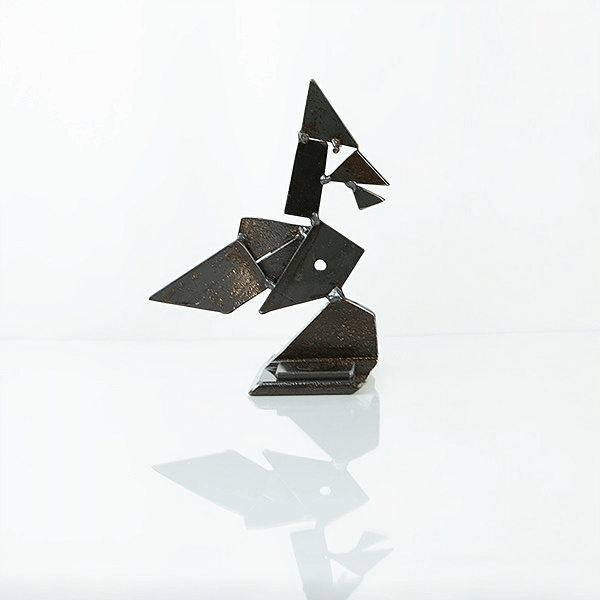 metal sculpture of a waxwing bird