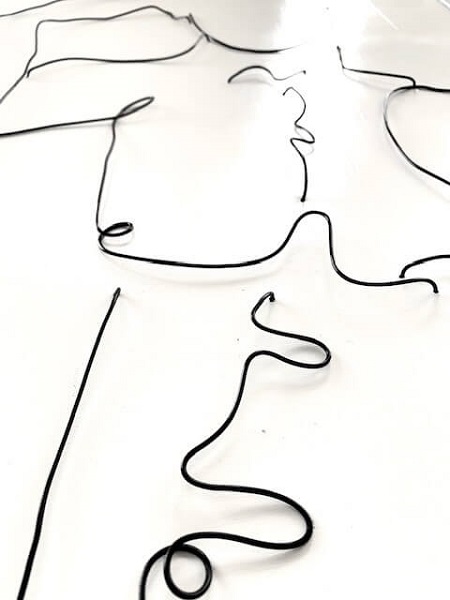wire on canvas artwork of a nude male torso