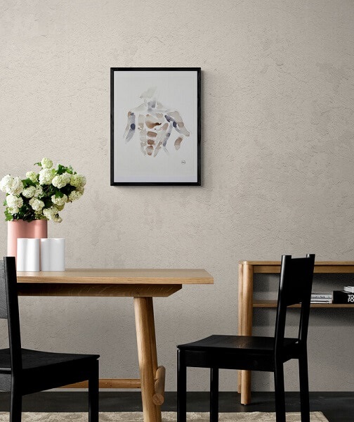 artwork of a male torso made from organic berry ink on paper framed and hung in a dinning room