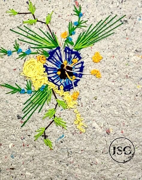 embroidery of flowers on homemade paper