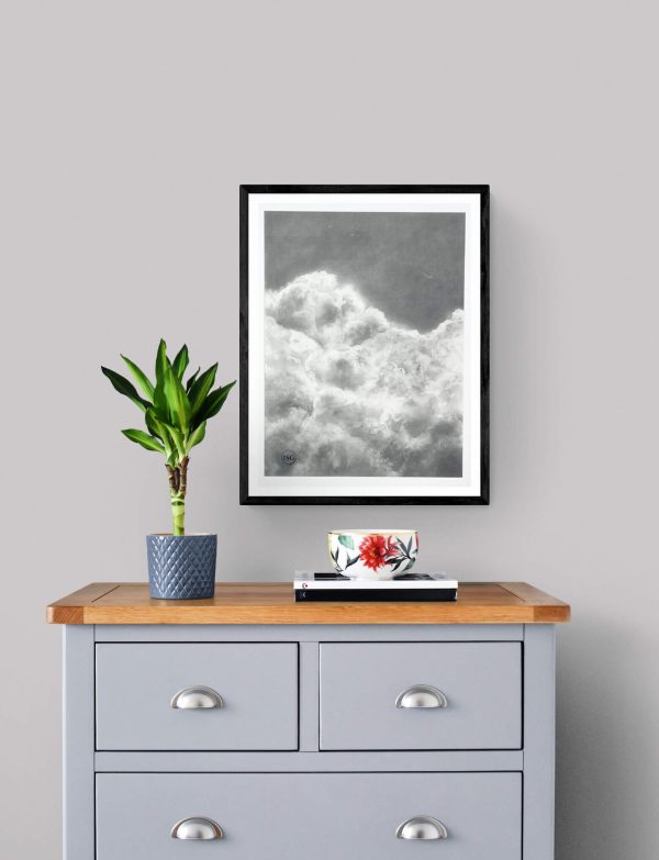 charcoal drawing framed at 21" x 29". This serene artwork captures the soft, airy beauty of drifting clouds, adding a touch of calm and elegance to any space.