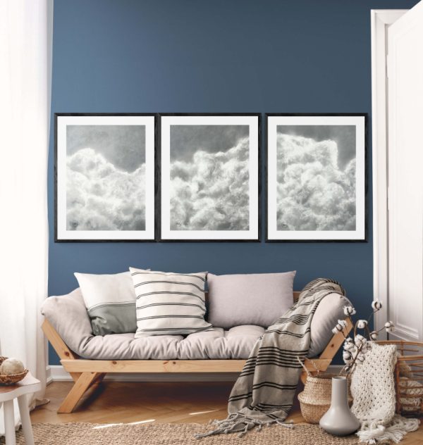 charcoal drawing framed at 21" x 29". This serene artwork captures the soft, airy beauty of drifting clouds, adding a touch of calm and elegance to any space.